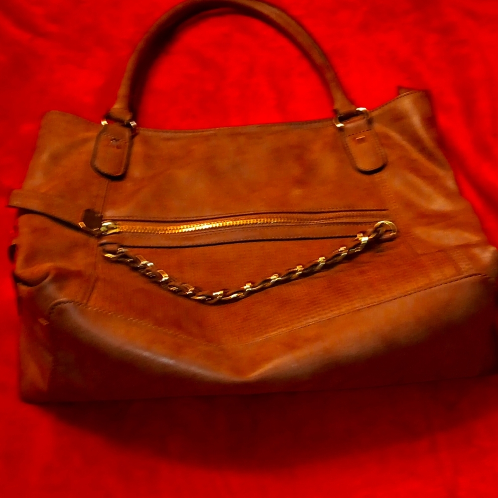 NICOLE MILLER, Tan leather purse with zipper on front & back.